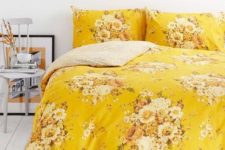 yellow print bedding to add a touch of color to a bedroom