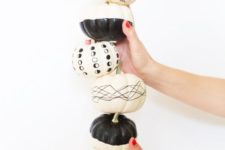 04 stylish black and white pumpkins with geometric patterns for modern Halloween decor