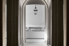 Arched windows and walkways add elegance to the apartment