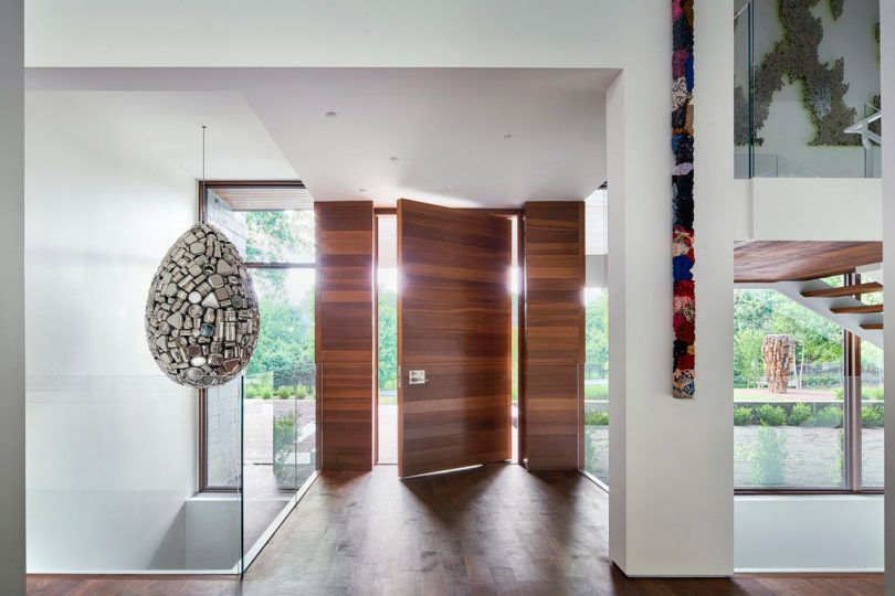 The entryway immediately strikes with a unique egg shaped pendant lamp