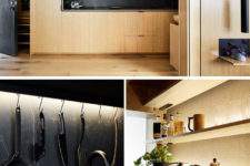 05 The kitchen is a light-colored wood unit with black marble for a contrast