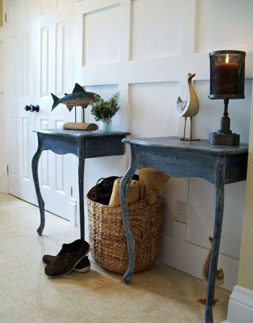 a duo of entryway consoles made of a vintage table cut in halves and painted blue