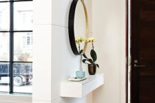 small console that provides storage in an entryway