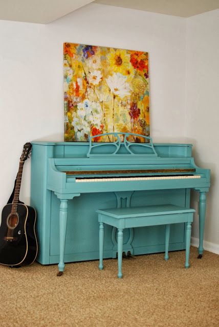 an egg blue piano and a bold contrasting floral artwork will add color and interest to the nook