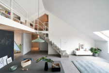 06 The concrete staircase looks architectural and chalkboard panels cover the kid’s space