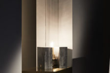 06 The pieces features a base and a large cylindrical lampshade of glass