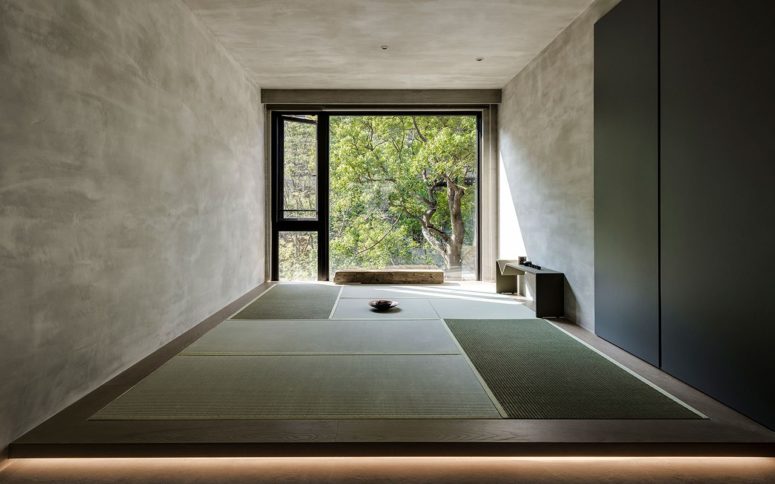 This is a meditation room with a gorgeous natural view and traditional Japanese mats on the floor
