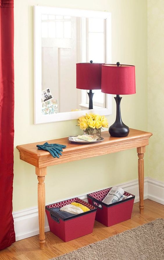 a simple wooden half table as an entryway console will hold everything you need