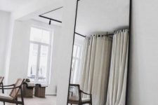 oversized mirror to make a room looks bigger