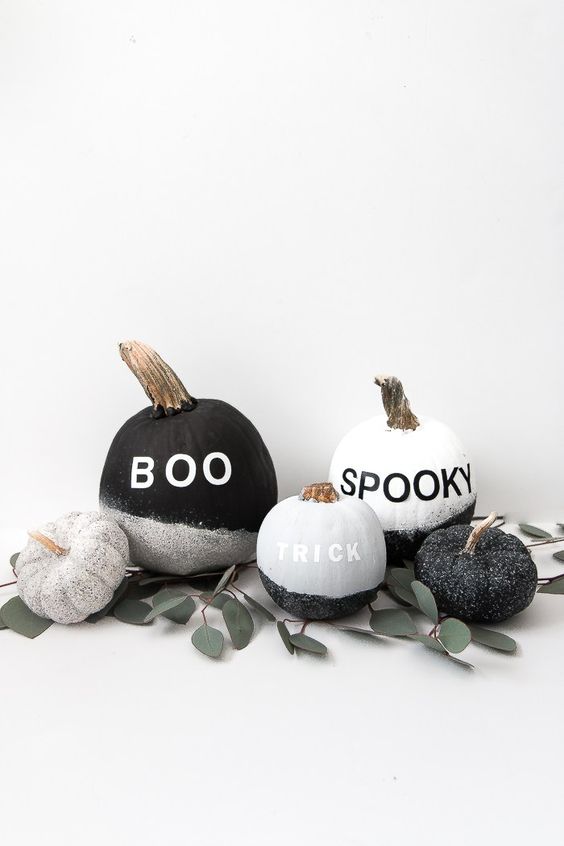 make a display of cool  black and white glitter pumpkins with vinyl letters - they are veyr easy to DIY