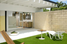 08 The outdoor space includes some loungers, sitting zones and a perfect lawn