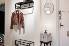 08 a coat rack features a holder for clothes hangers, which has an airy look and accommodates many items