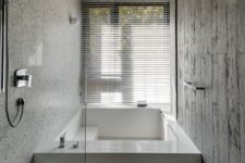 minimalist bathroom design with a sunken bathtub