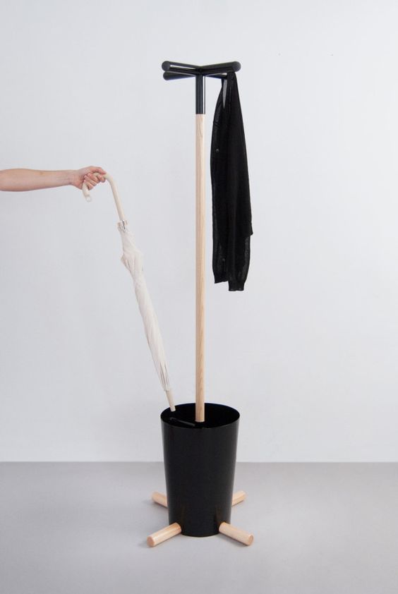 A modern coat rack with a so called pot for umbrellas and a coat rack looks bold and catchy