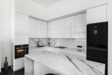 10 The kitchen is done in black and white with marble surfaces