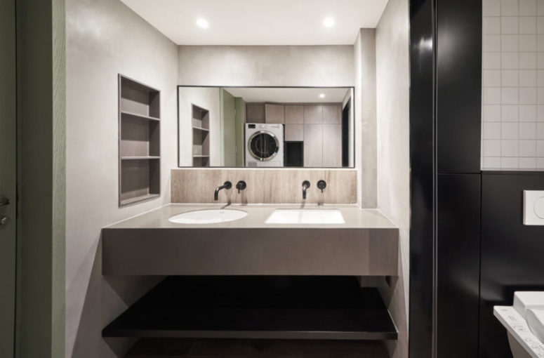 The master bathroom is done in black and white, with neutrals and a double floating vanity