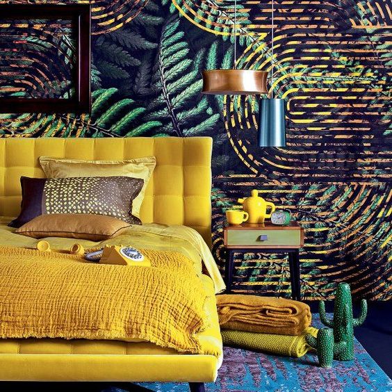 a bold yellow upholstered bed with bedding and blankets of the same color for a touch of sun