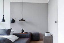 11 a grey element and a black upholstered podium bed for an edgy color block bedroom look