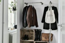 11 a metal holder for clothes hangers and one more L-shaped coat rack for hanging pieces with style