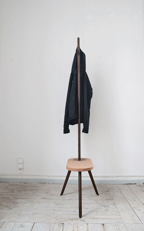 a very simple coat rack with an additional stool as a base of it is a great combo for a tiny space