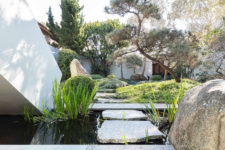 12 The garden is perfectly styled, with water features and large rocks