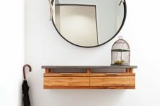 12 a floating console of wood with a concrete tabletop and a framed mirror with rope for a coastal space