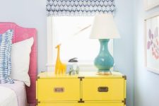 12 a large and functional dresser nightstand in bold yellow with metallic handles
