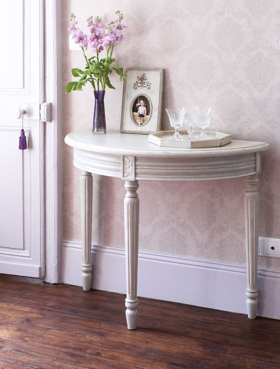 a vintage grey console table with elegant legs will add a refined touch to your space