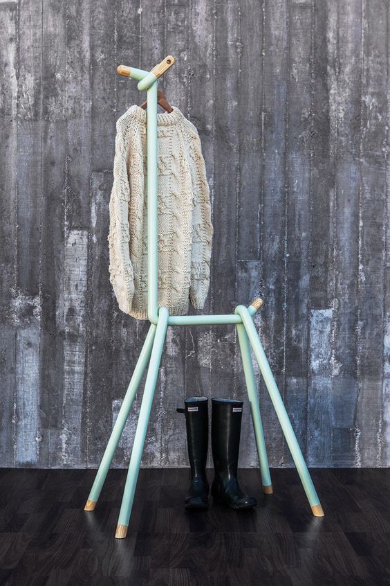 a coat rack imitating a deer in mint and gold is a fun and whimsy idea for any entryway plus it's rather functional