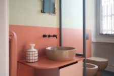 14 a light yellow and coral plus matching pinkish fixtures for the powder room to give it a mid-century modenr feel