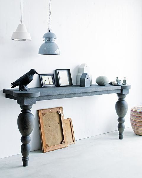 a whimsy living room console with chic legs is a long narrow piece that provides enough storage