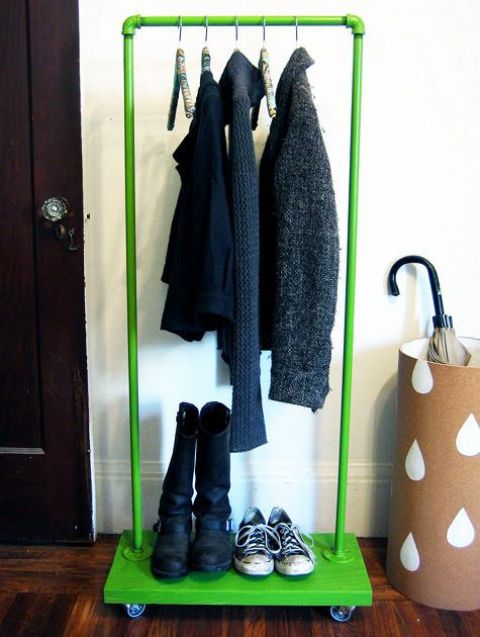 a colorful clothes rack with a base on casters used for shoe storage is a great idea to add a touch of color
