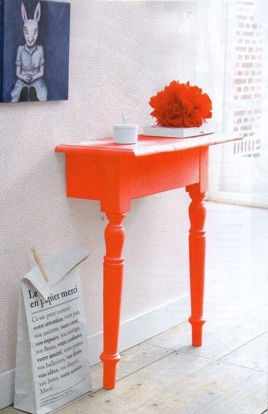 Chop a table in half to make the ultimate space saving entryway table and then paint it bold