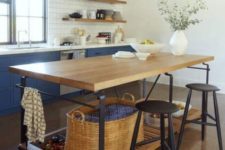16 a chic kitchen with an industrial kitchen island of wood and metal plus storage space and tall stools