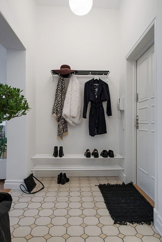 a stylish contemporary coat rack of metal is a comfy and simple piece for a monochromatic space