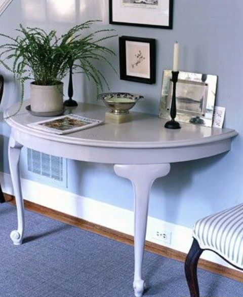 if you have enough space but want to add something catchy to your entryway, a half round console is ideal