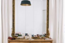 17 make a statement in a modern space with an oversized vintage mirror with chic detailing