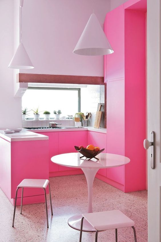 a super bold contemporary kitchen in bright pink and lavender for a colorful look