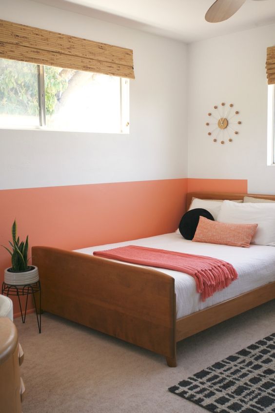 Accent your sleeping zone with color blocking like here   a orange accent on the wall