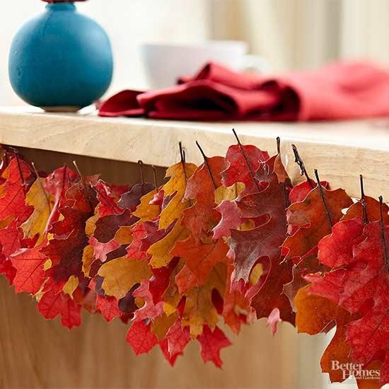 bring the beautiful autumn colors indoors by stringing freshly fallen oak leaves