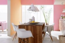 19 color blocked kitchen walls in pastel pink and orange plus wooden furniture for an inviting eat-in space