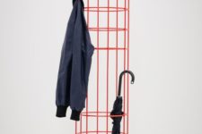 20 a red metal coat rack features several hooks for hanging and enough storage space for your umbrellas