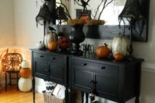 an entryway console table with Halloween bunting