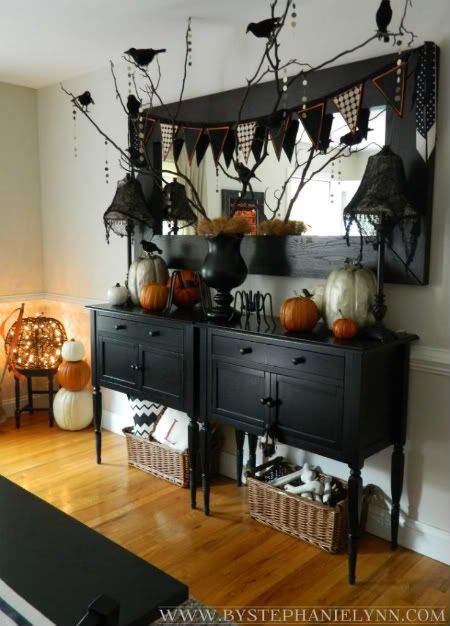 an entryway console table with Halloween bunting