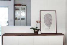 21 a stylish floating console of a white dresser with a dark-stained tabletop is all you need for a contemporary entryway