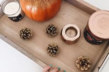 21 take a tray and display gilded pinecones and a pumpkin and some candles for a fall feel