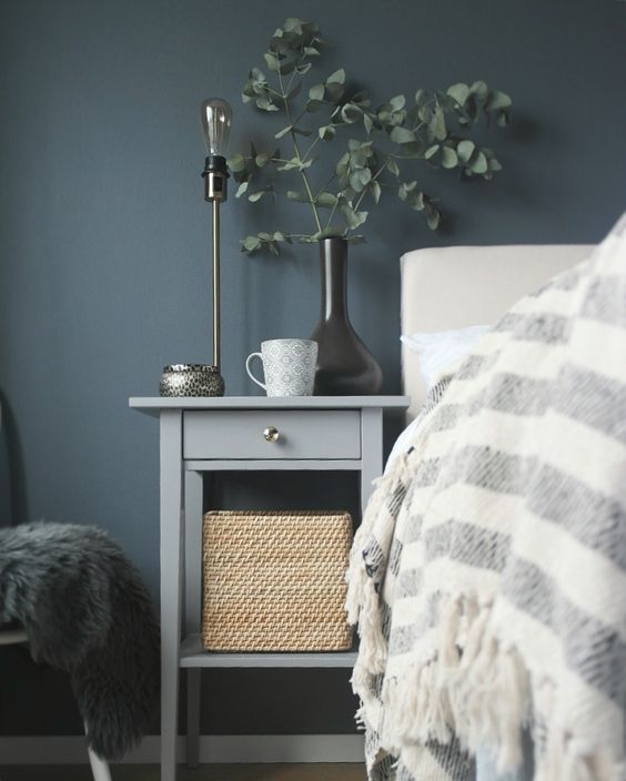 a small and modern bedside table by IKEA is all you need