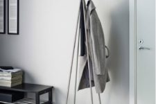 22 a stylish minimalist coat rack of plywood and metal looks airy and chic and doesn’t take much space