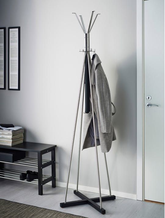 a stylish minimalist coat rack of plywood and metal looks airy and chic and doesn't take much space