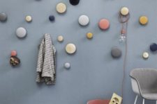 22 attach some colorful dot hooks of different sizes to the wall to make hanging pieces whimsical and cool
